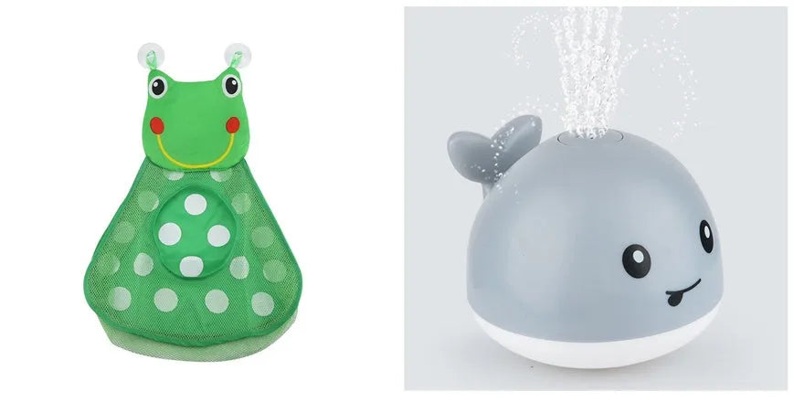 White and blue whale-shaped bath toy spraying water with LED lights on, floating in a baby bath
