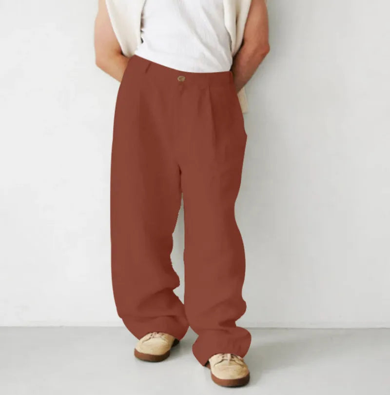 Men's loose high-waist linen jogger pants in a straight-leg cut, shown in a neutral colour.