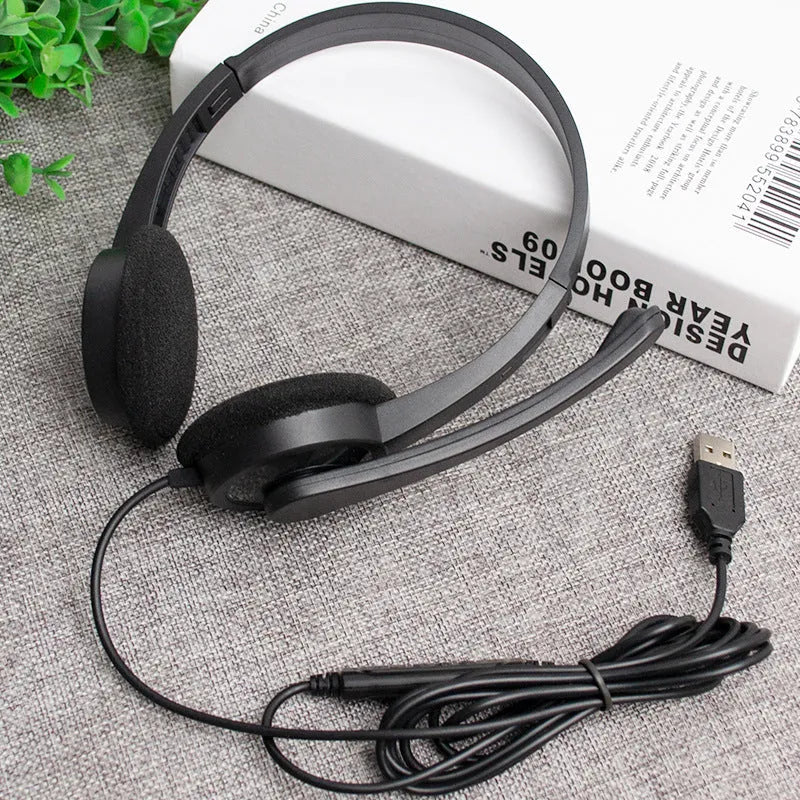 Black wired USB headset with sponge ear cushions and microphone for computer gaming and calls