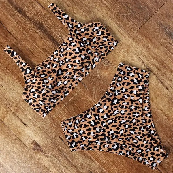 Women's high waist leopard print bikini set with push-up top and matching briefs on a mannequin.