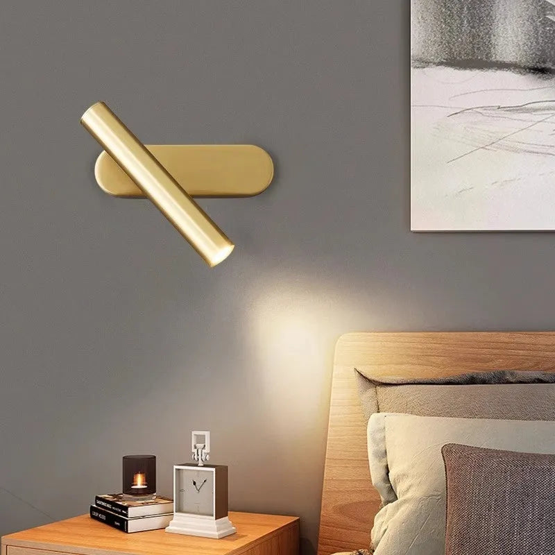 Copper wall lamp with three-colour variable light in black finish for bedside or stair use.