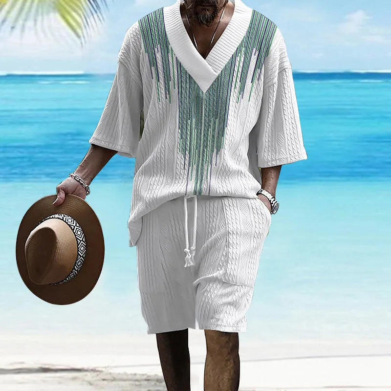 Man wearing a printed drop-shoulder knitted short-sleeve jacket with matching shorts in a casual setting.