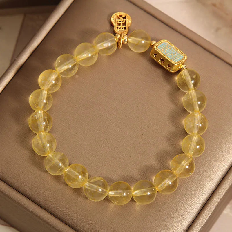 Women's yellow citrine crystal bracelet with rhinestone decorations on wrist