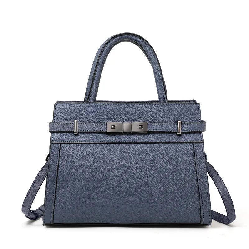 Women's genuine leather crossbody bag in horizontal square shape with clamshell opening showing internal organisation pockets