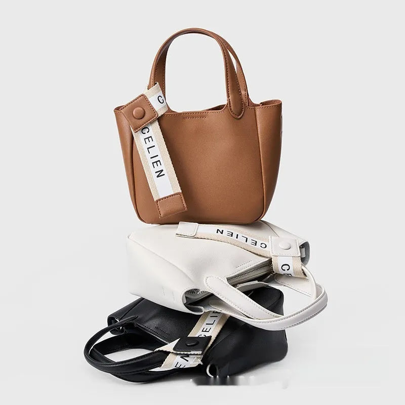 Genuine cattlehide leather cross body bucket bag in square vertical retro style.
