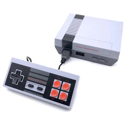 Compact black retro NES game console with two rectangular controllers on a white background.