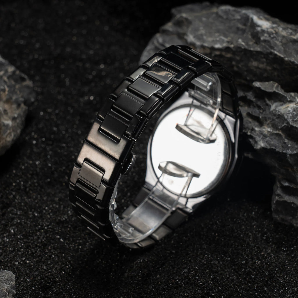Business casual men's quartz watch with steel belt, black dial, and slim 10mm case
