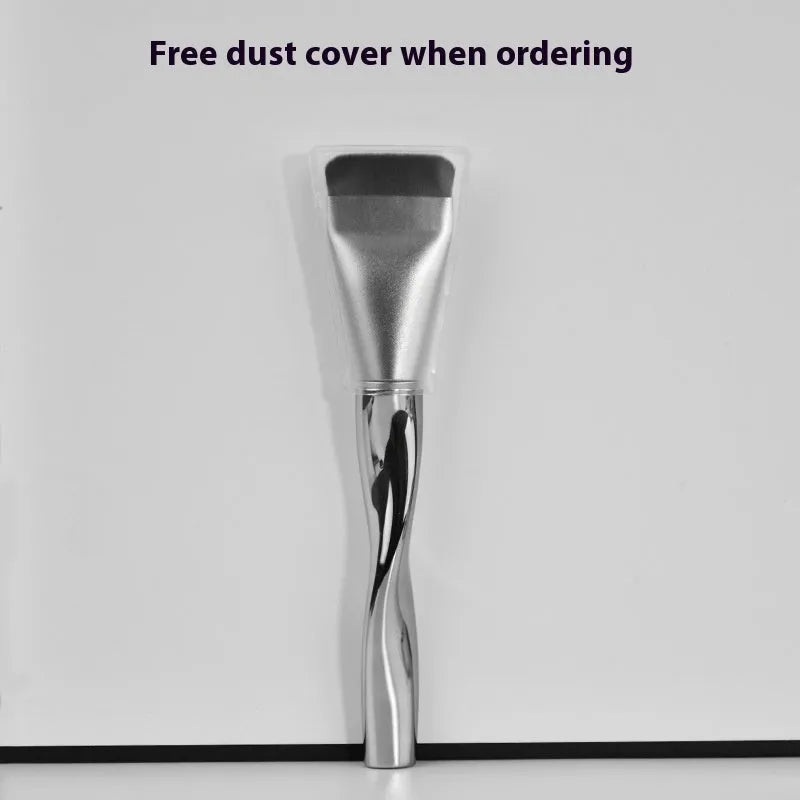 Spiral one-shaped black powder foundation brush with long handle and puff on pineapple box.