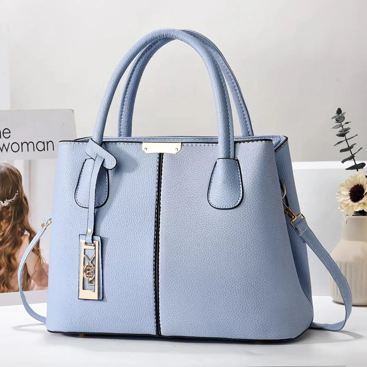 Women's large capacity shoulder bag in soft PU leather with adjustable strap and multiple colour options
