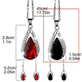 Black and red teardrop pendant alloy necklace and matching earrings set on a white background.