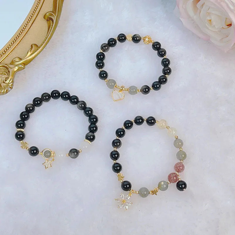 Women's silverstone charm bracelet with electroplated finish showing floral, heart, and star design options