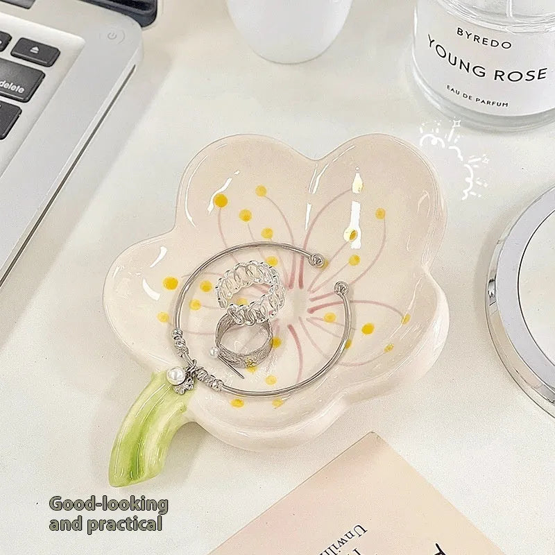 White porcelain storage tray holding a small night light, in yellow, pink, or white colour.
