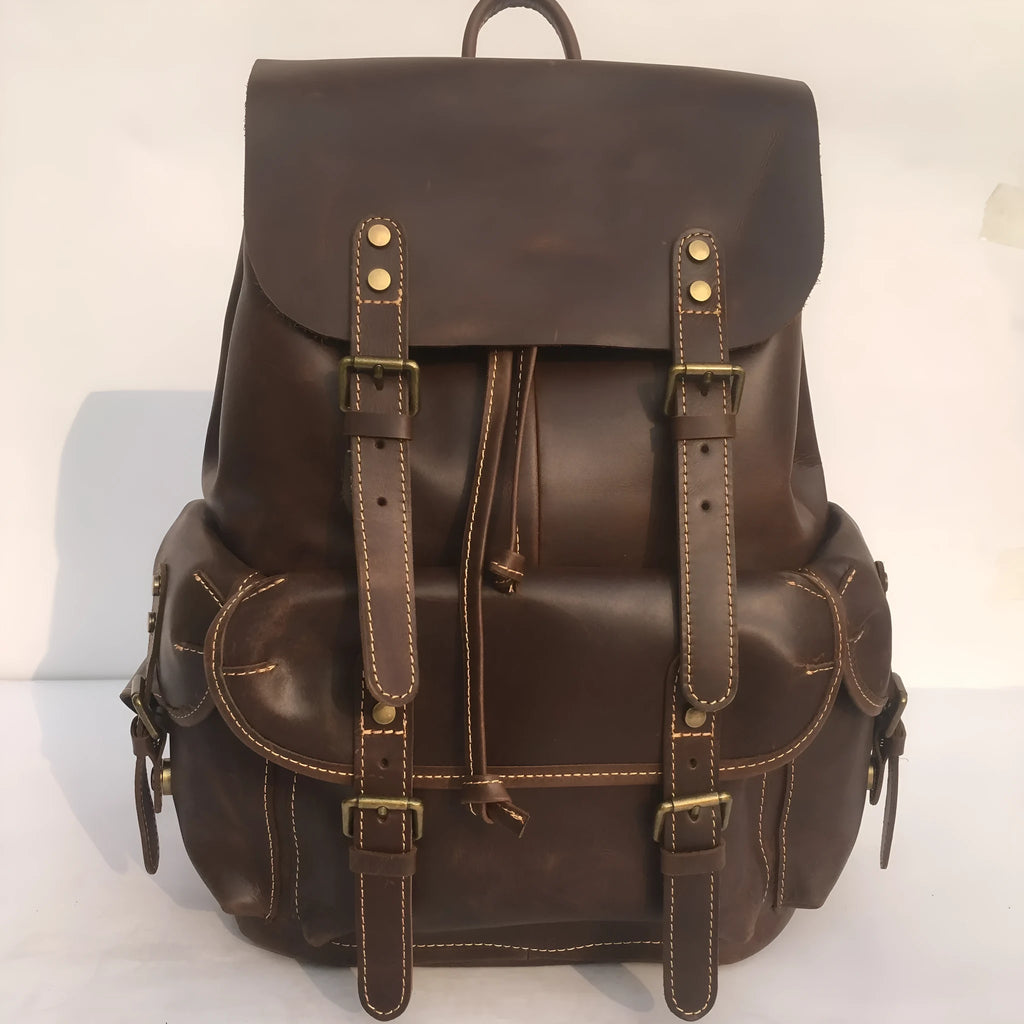 Brown genuine leather men's backpack with an air pillow belt system on the straps.