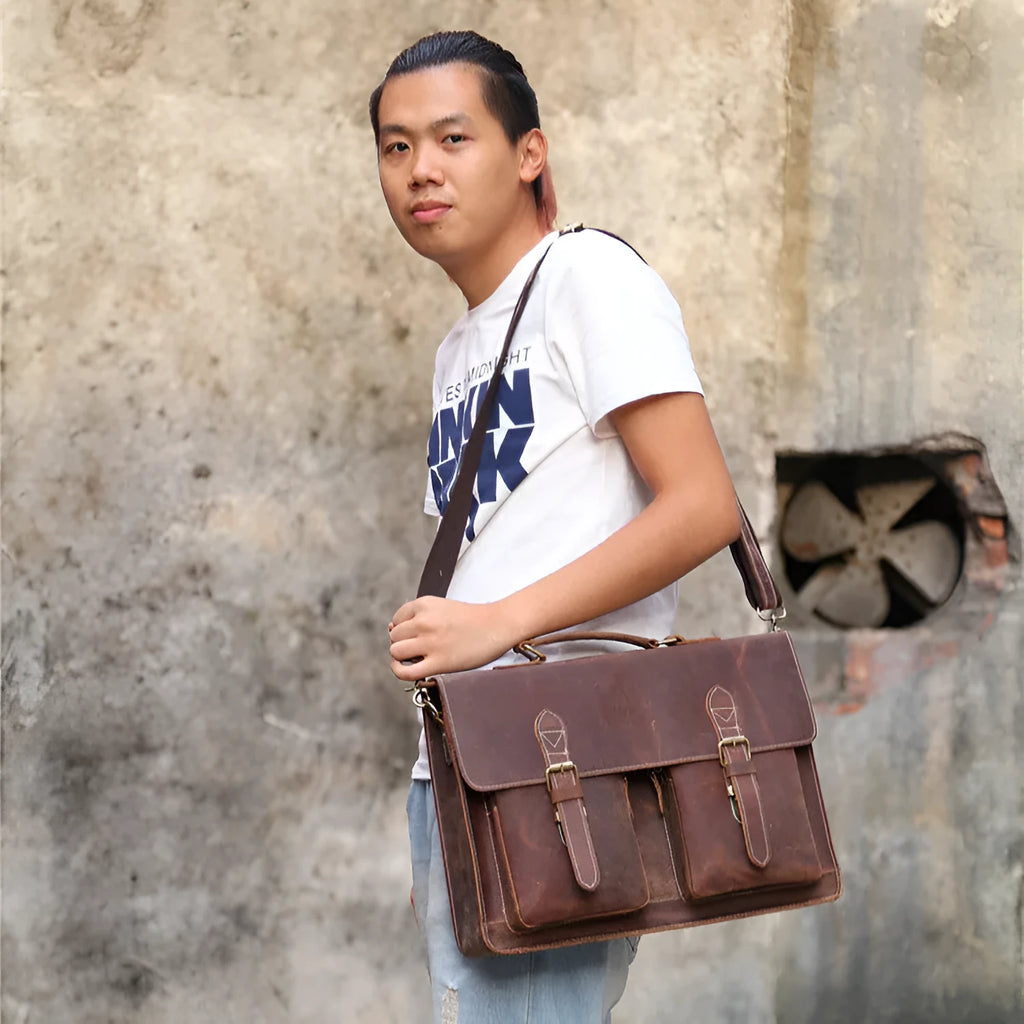 Small yellow brown Crazy Horse leather messenger bag with shoulder strap and nylon lining.