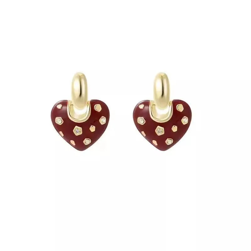 Pair of red heart-shaped ear studs in zinc alloy with electroplated finish