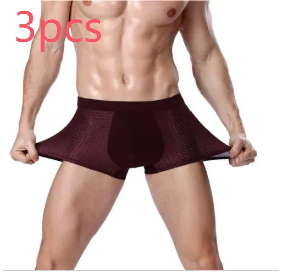 Men's solid colour ice silk modal boxer briefs with U convex design and mid-waist fit.