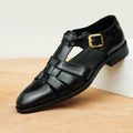 Men's black genuine leather retro sandals with open design and rubber sole.