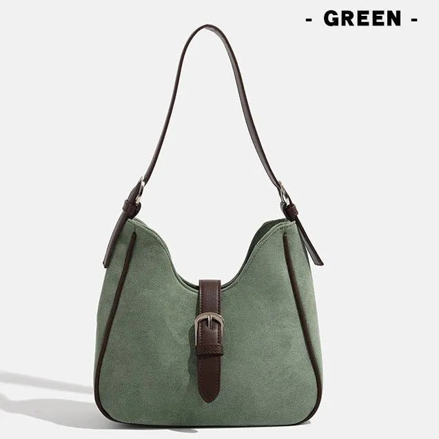 Retro suede leather underarm shoulder bag in brown with double connector straps on a white background