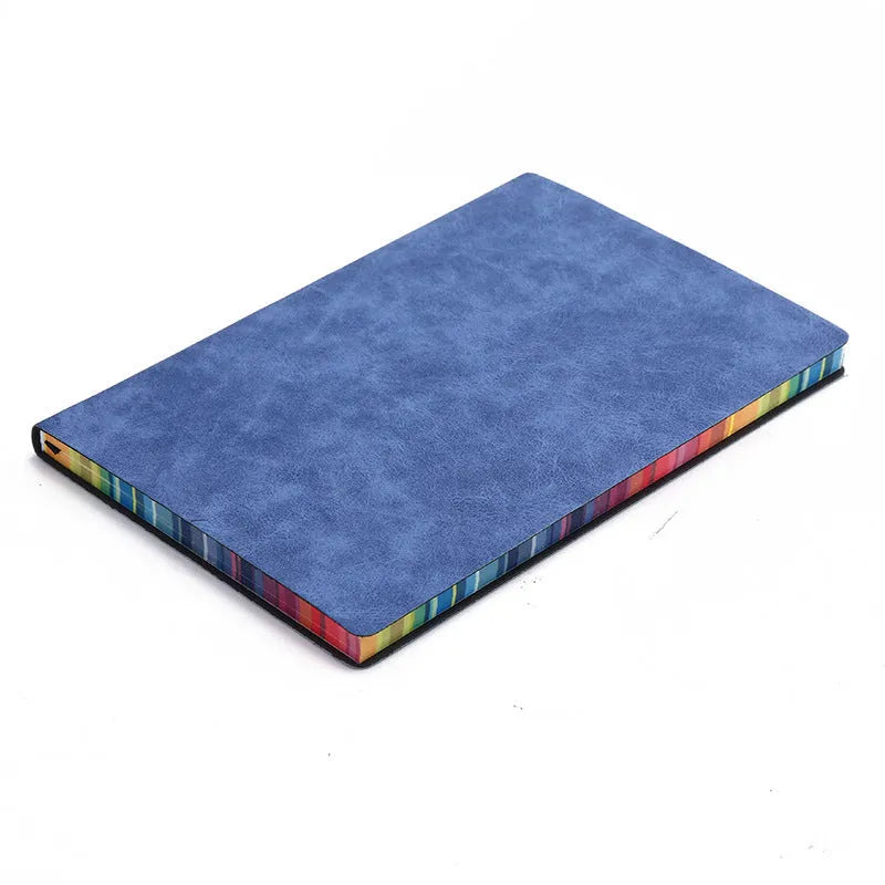 A5 rainbow side PU leather cover notebook open on a desk, showing lock line hardcover binding and 100g Daolin paper pages