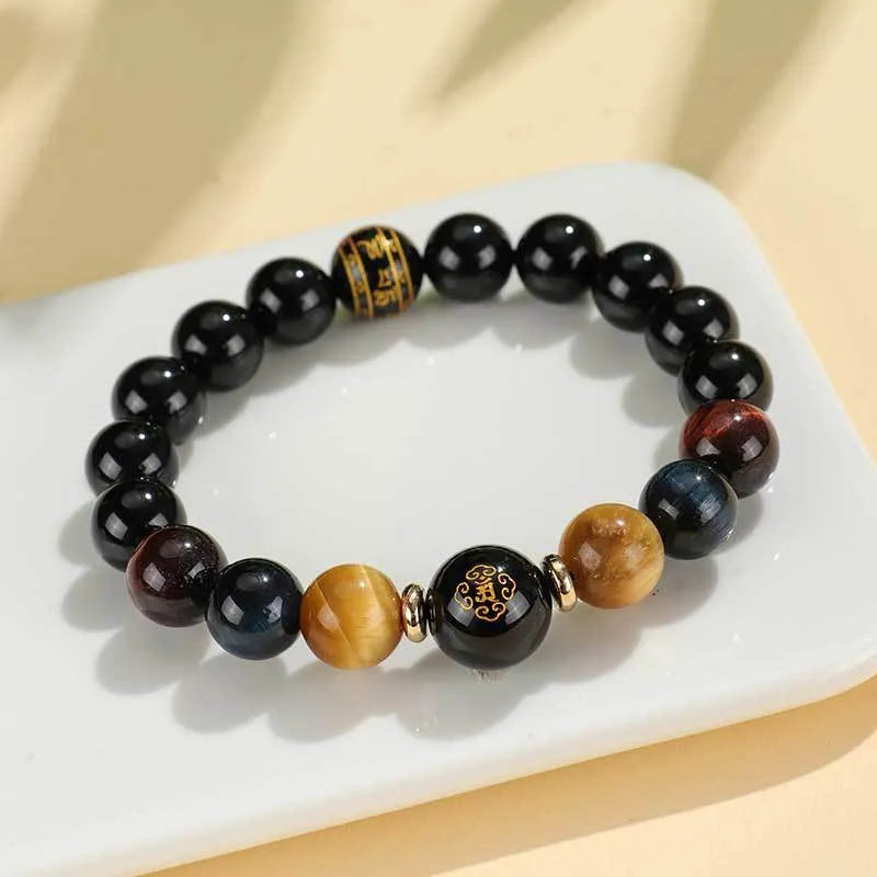 Handmade black agate beaded bracelet with Buddhist carving and tiger eye gemstones
