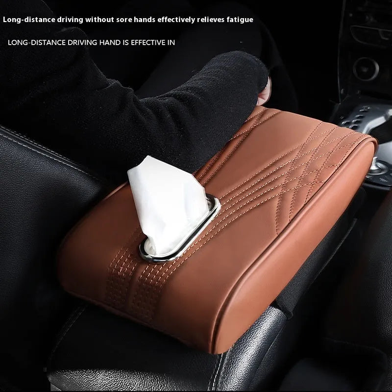 Black leather car armrest cover with angel pattern tissue pocket placed on a vehicle center console