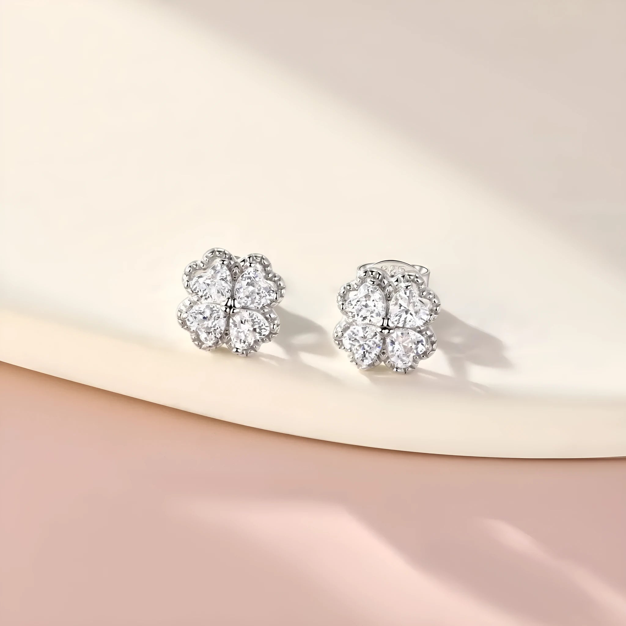 Pair of heart-shaped zircon earrings in 925 silver with a white gold finish.