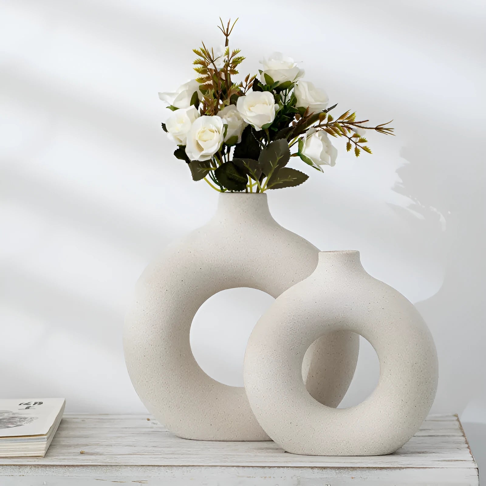 Unglazed porcelain biscuit vase with frosted particle surface in neutral colour