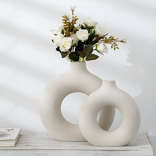 Unglazed porcelain biscuit vase with frosted particle surface in neutral colour