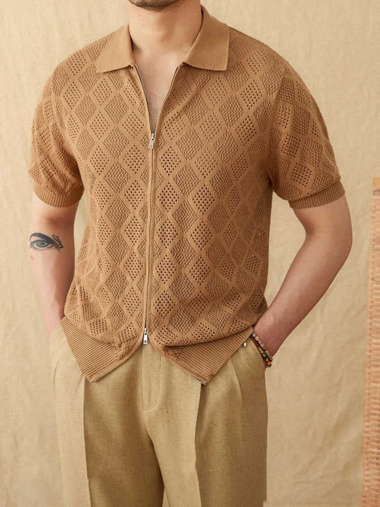 Light brown cotton short sleeve cardigan with a front zipper and lapel collar laid flat.