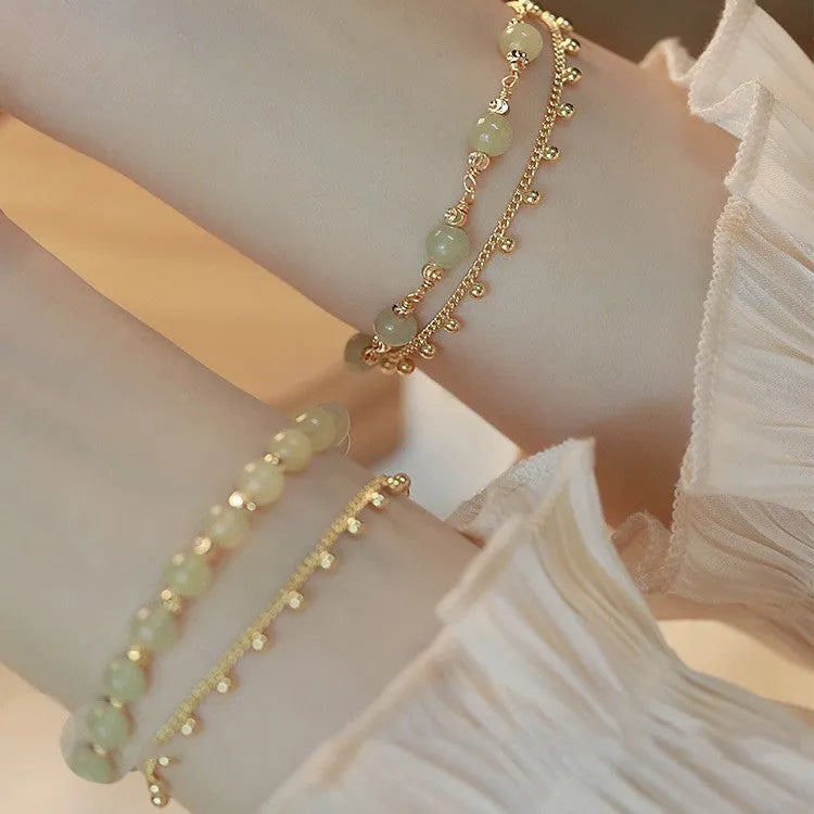 Hetian Jade bracelet with princess running beaded style on neutral background