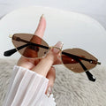 Metal small frame cat eye sunglasses with gold frame and grey lenses