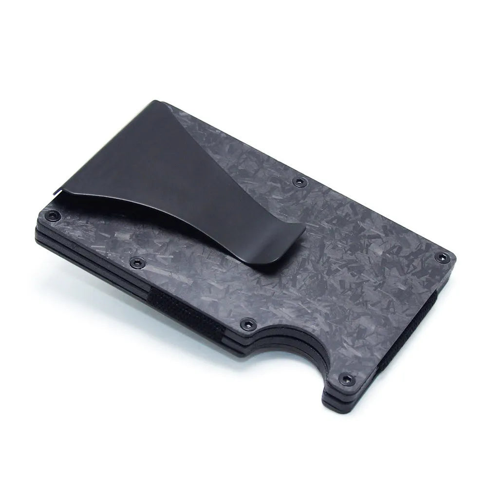 A slim carbon fibre card holder wallet in a geometric design, shown with business cards.