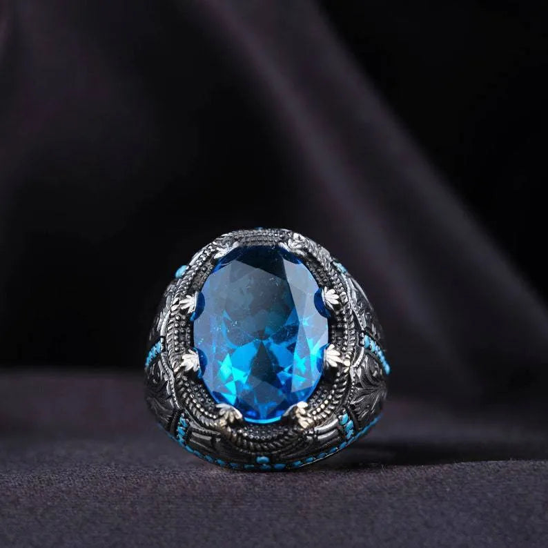 Geometric antique silver alloy ring with blue zircon stone showing European American styling