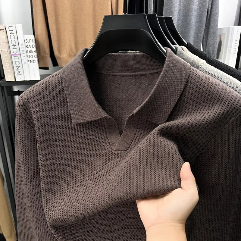Men's loose fit casual green pullover sweater for autumn layering on a hanger.
