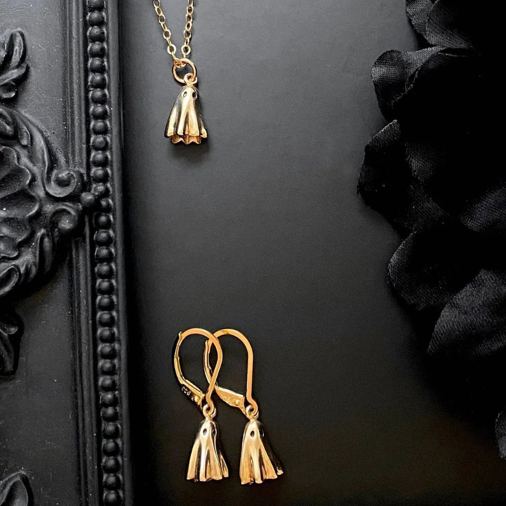 Ghost pendant necklace on a twisted stainless steel chain, shown in Cable, Figaro, and Mini Staple style options.