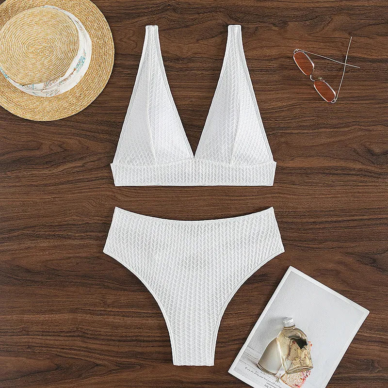 White backless women's bikini swimsuit on a mannequin