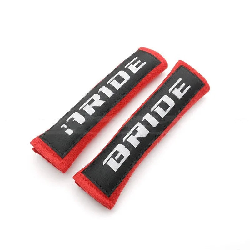 Car safety belt shoulder pad set in black showing cotton construction and embroidery detail