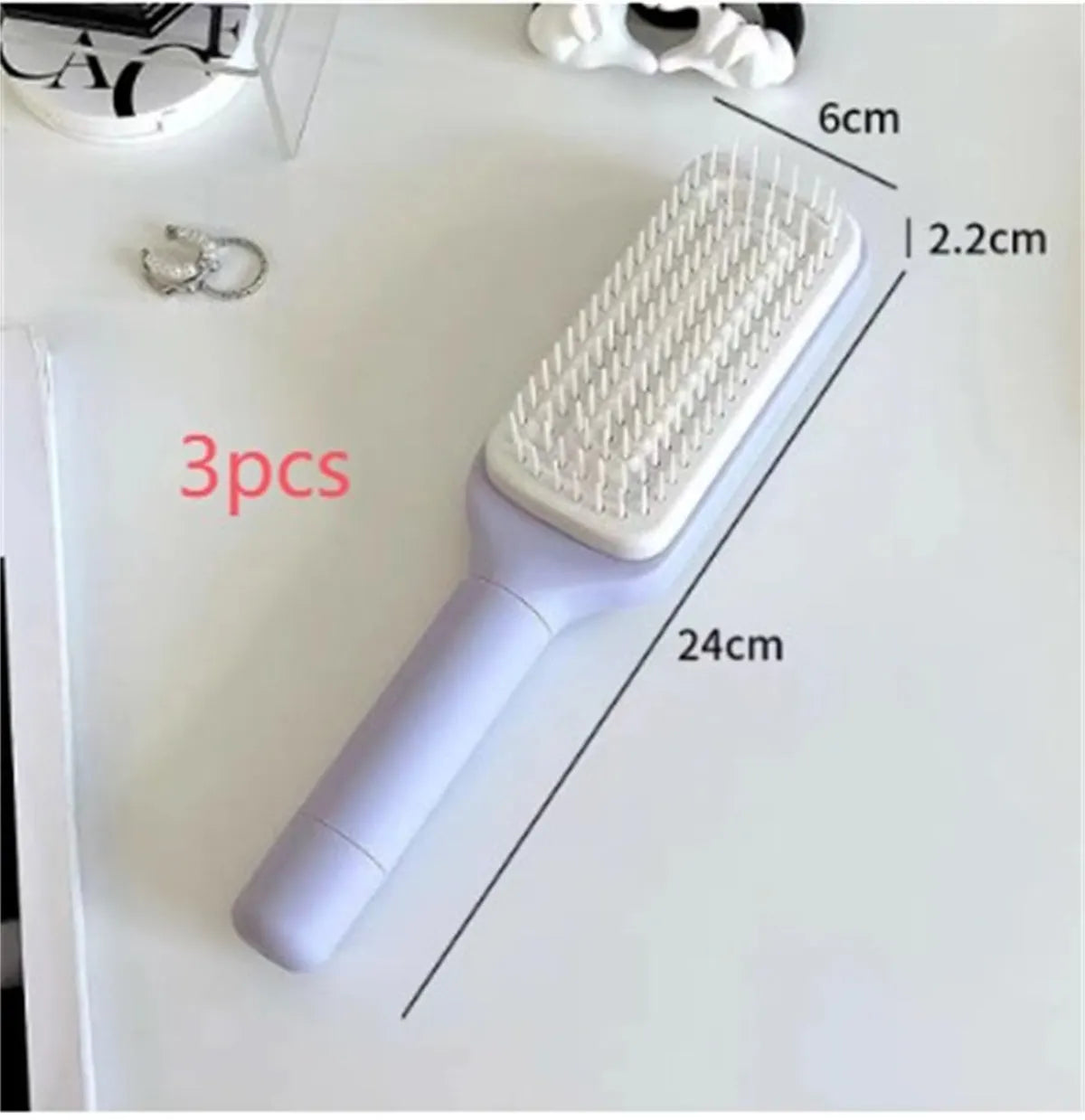 Roland purple self-cleaning hairbrush with rotating handle and anti-static massage teeth