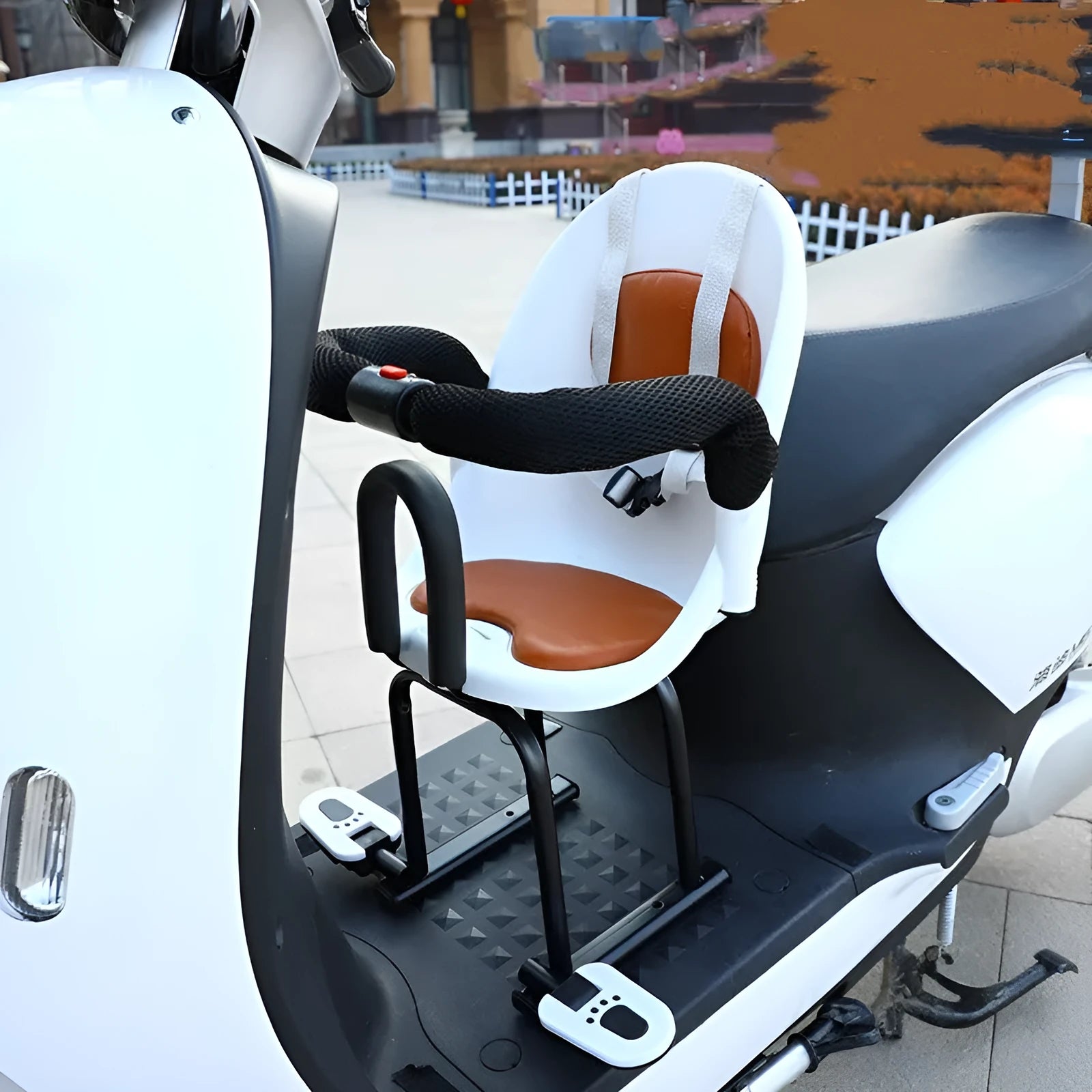 Black front child safety seat for an electric scooter, showing a high carbon steel frame.