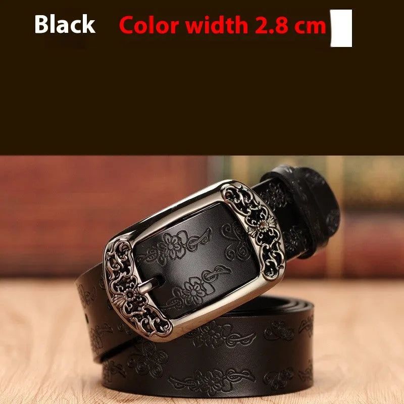 Thin black women's PU leather belt with alloy buckle fastening on jeans