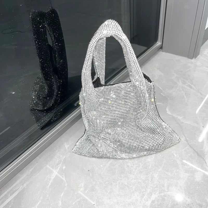 Silver ladies handbag with rhinestone embellishment on cotton thread construction and open outer pocket