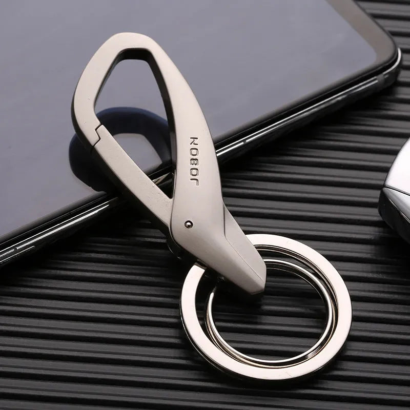 Black zinc alloy double ring car keychain attached to a belt loop.