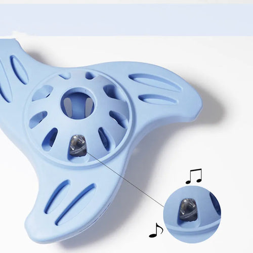 Blue boomerang-shaped dog chew toy with textured molar ridges