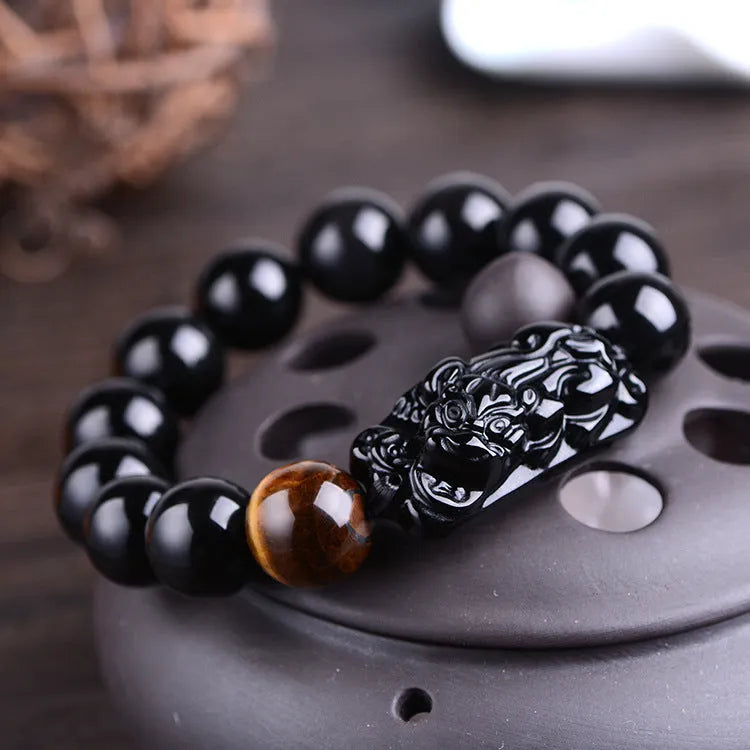 Natural obsidian Pi Xiu bracelet with carved charm, 12mm beads, on a gift box