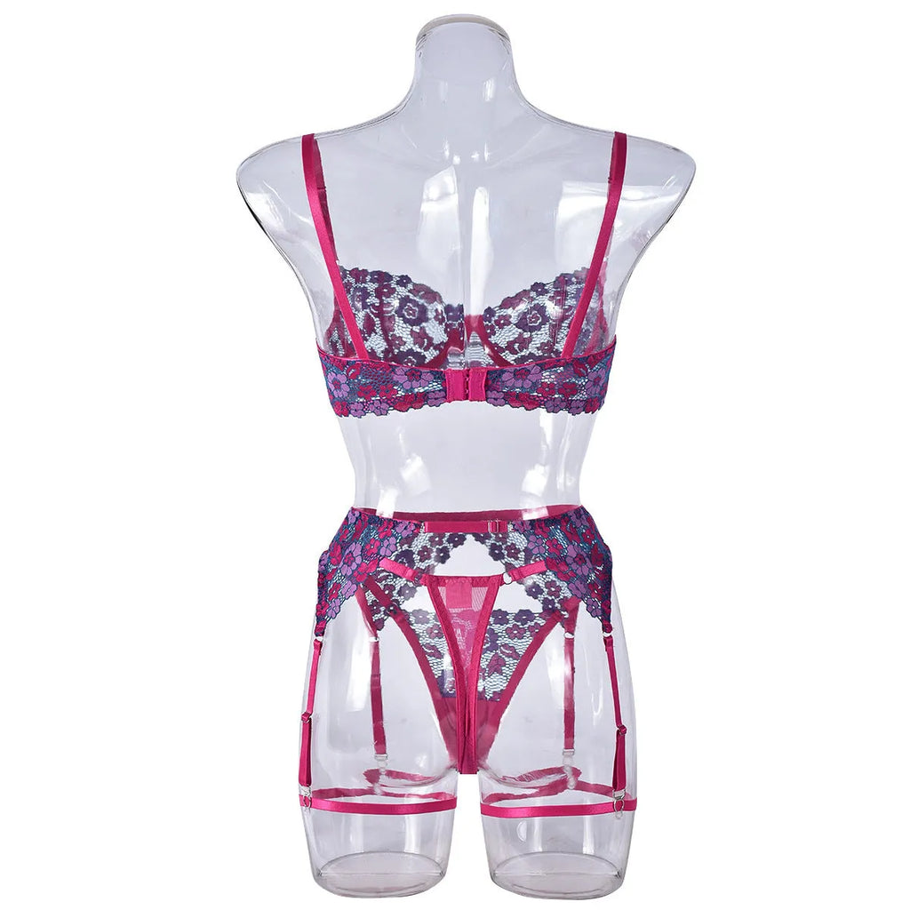 Rose red women's bikini swimwear set with embroidered contrast colour detail on mannequin
