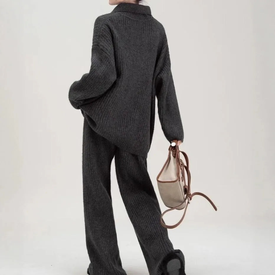 Acrylic fibre sweater suit two-piece set in beige, showing knitted top and casual trousers.