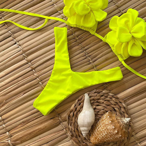 Women's low waist bikini swimsuit with 3D flower design in solid colour
