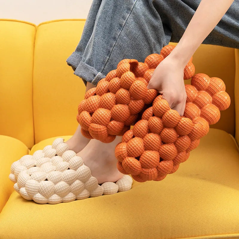 Creative Herringbone Baotou thick-soled bathroom slippers in orange, EVA sole with textured tread and upturned toe