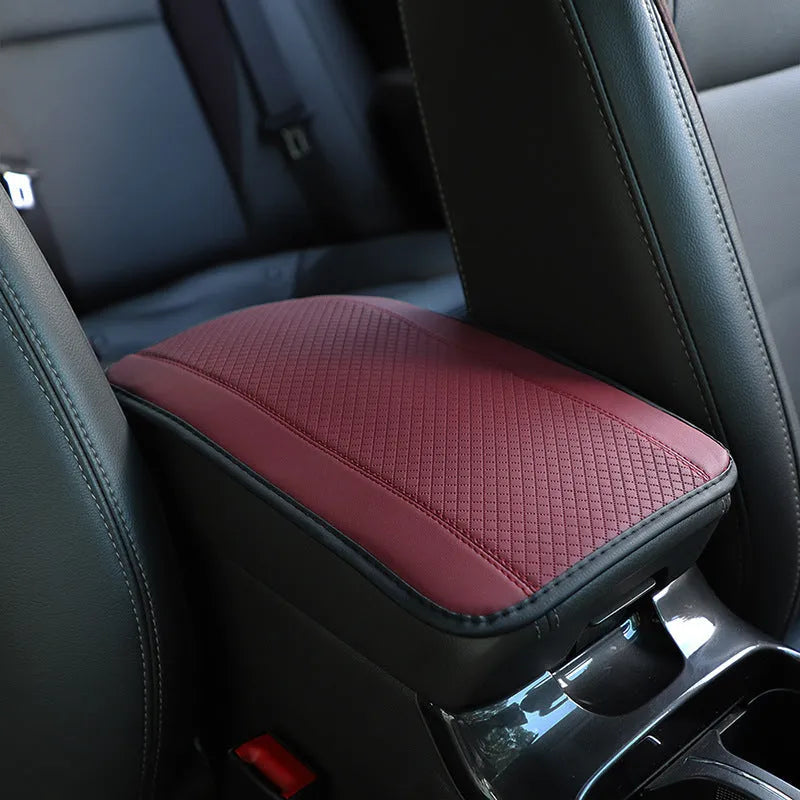 Black embossed PU leather car armrest box cushion mat measuring 32 by 19 centimetres.