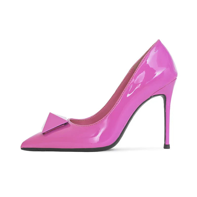 Pink patent leather women's stiletto heels with pointed toe, rivet decor, and a buckle.